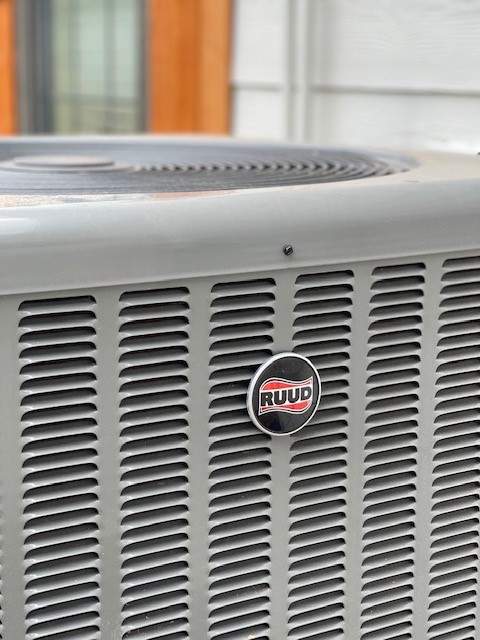 A grey Rudd AC condenser.
